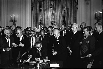 President Lyndon B. Johnson signs the 1964 Civ...